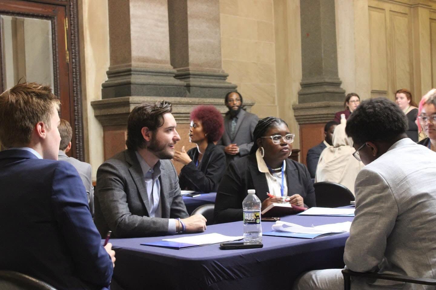 Joe Picozzi in conversation with residents at a roundtable