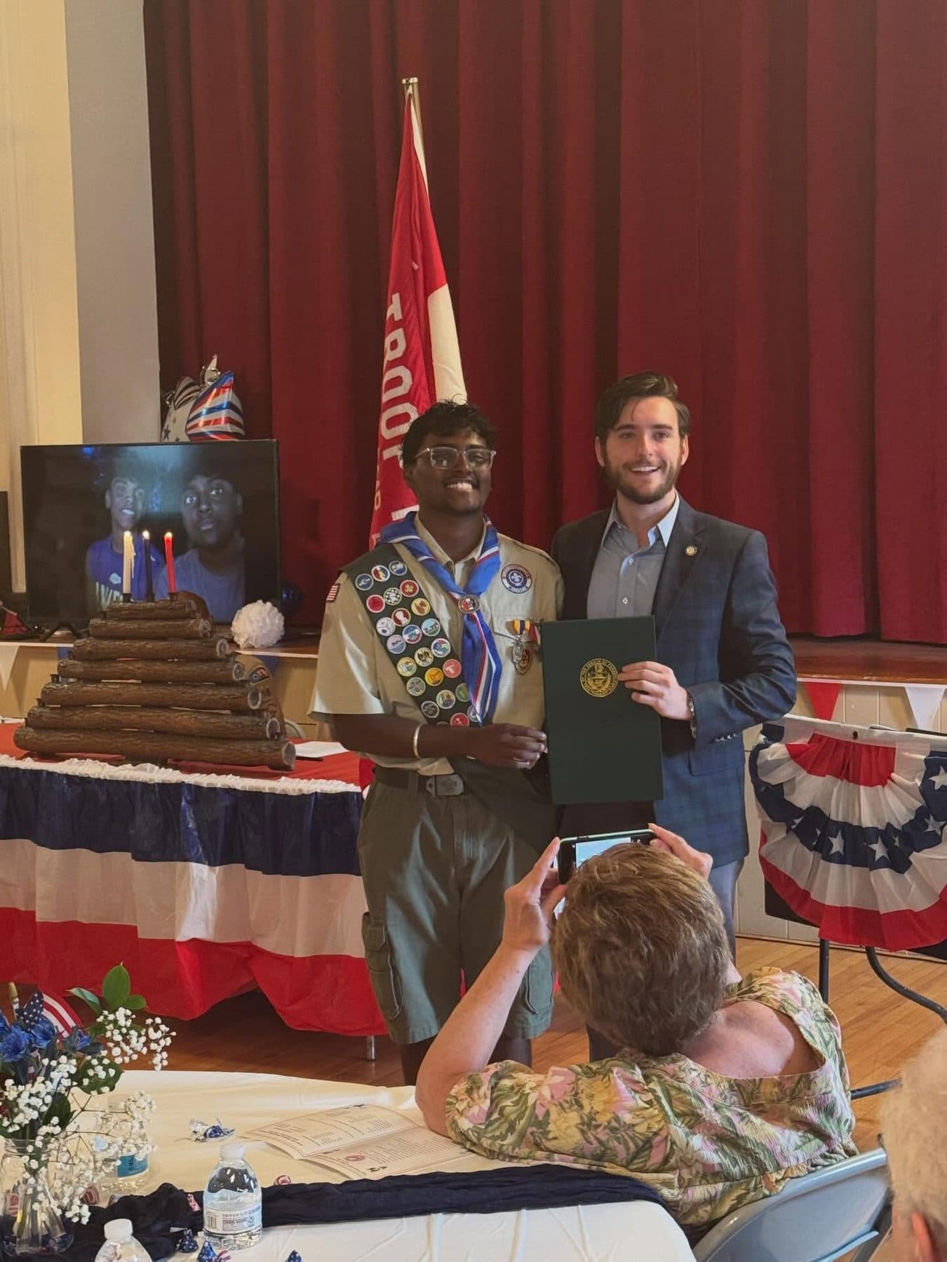 Joe Picozzi with a new Eagle Scout holding a citation at a court of honor