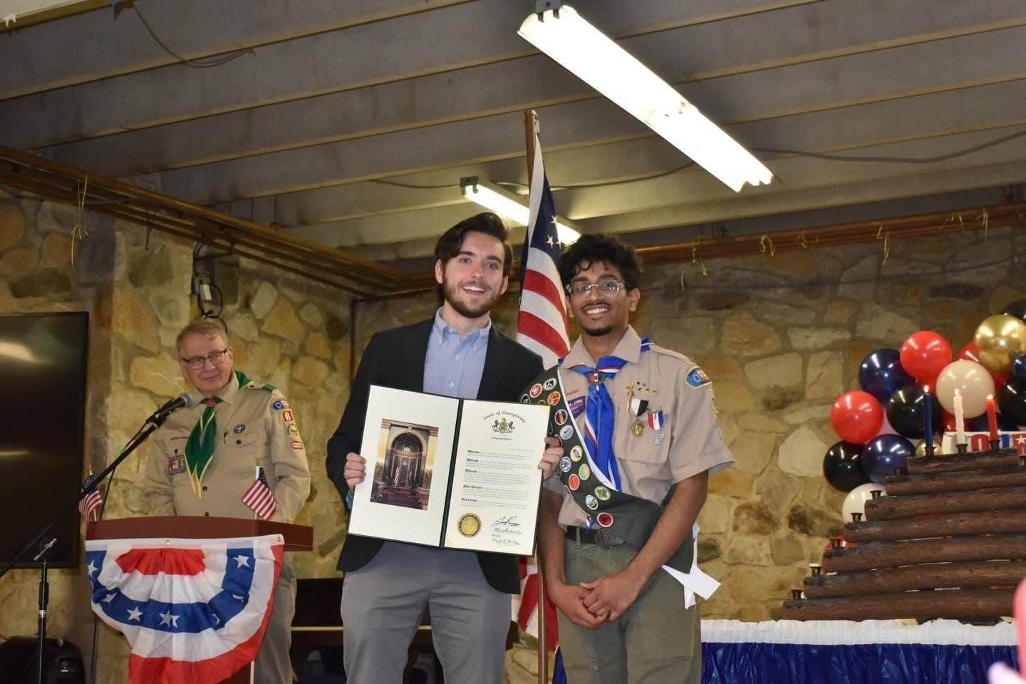 Joe Picozzi presenting a Senate citation to a new Eagle Scout at a court of honor